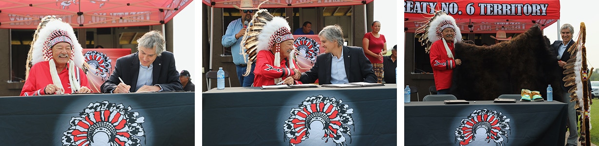 Dow Canada president Diego Ordonez and Alexander First Nation Chief George Arcand Jr. sign the MOU and share a gift